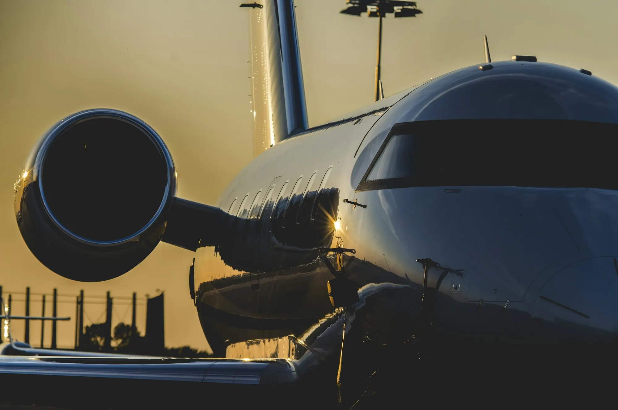 Nose and engine of a business jet in low golden light