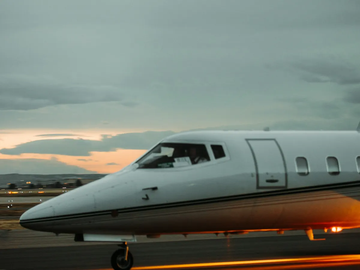 Nose of a business jet on the ramp at dusk