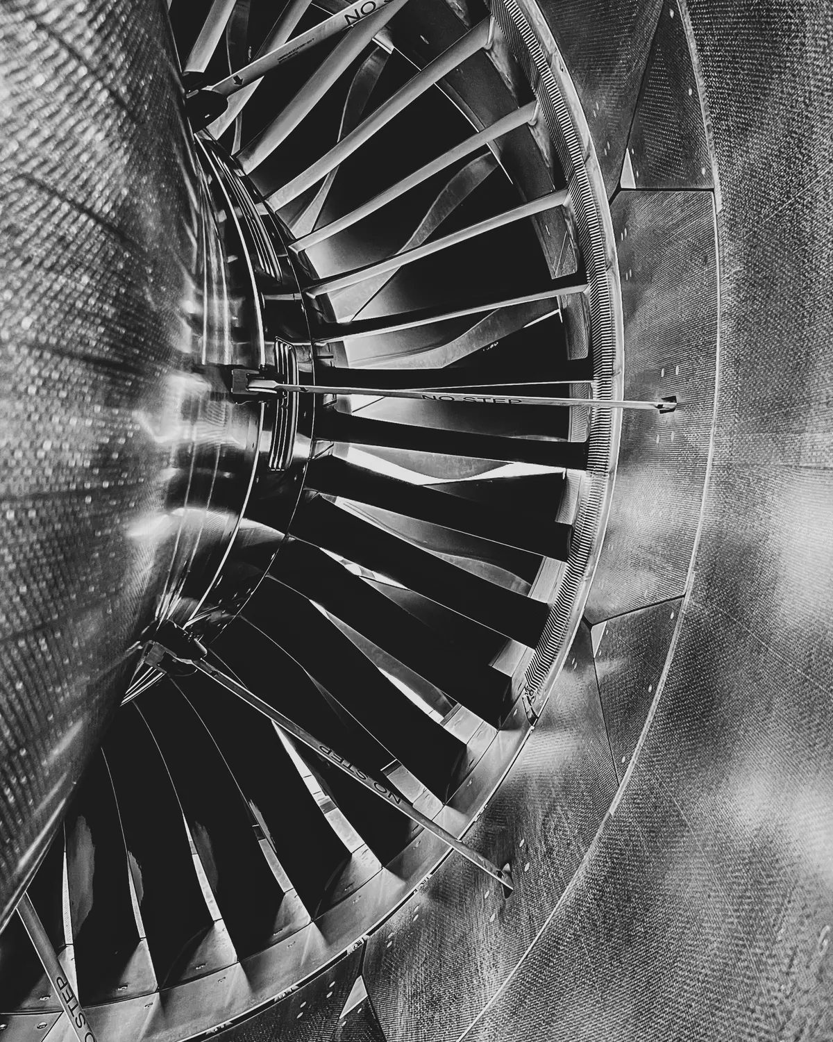 Close-up of jet engine fan blades in black and white